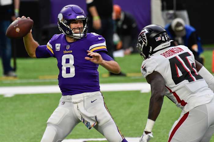 Oct 18, 2020; Minneapolis, Minnesota, USA; Minnesota Vikings quarterback Kirk Cousins (8) prepares to throw a pass as Atlanta Falcons linebacker Edmond Robinson (46) rushes during the first quarter at U.S. Bank Stadium.
